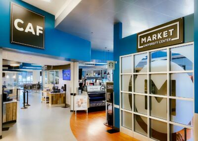 View of UC's on-site dining entrance showing The Caf & The Market.